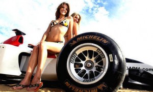 2 Beautiful GirlsSitting on a Formula 1 Car